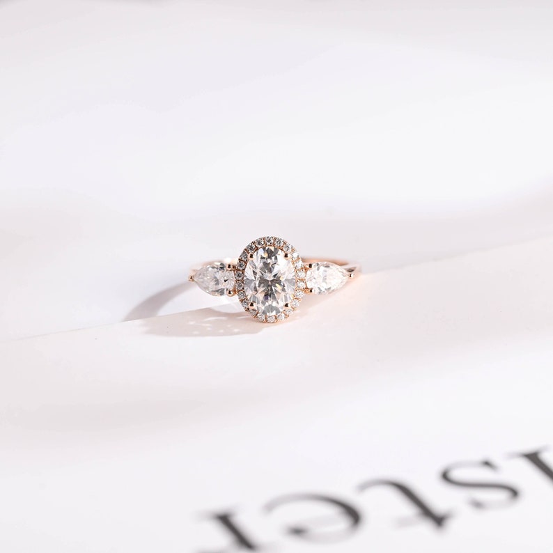 Stunning 1.0 - 2.0 CT Oval Moissanite Engagement Ring with Three Stone & Halo Design 1