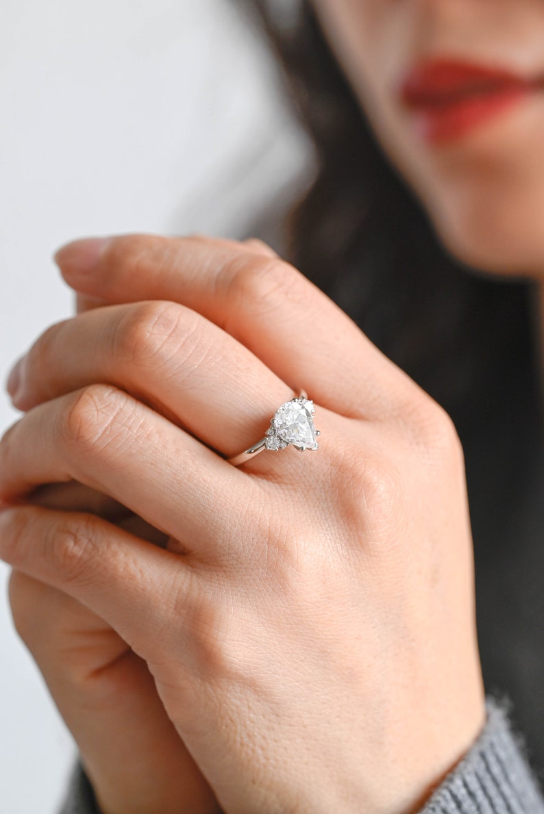 Stunning 1.0 - 2.0 CT Pear Moissanite Engagement Ring with Cluster Design 6