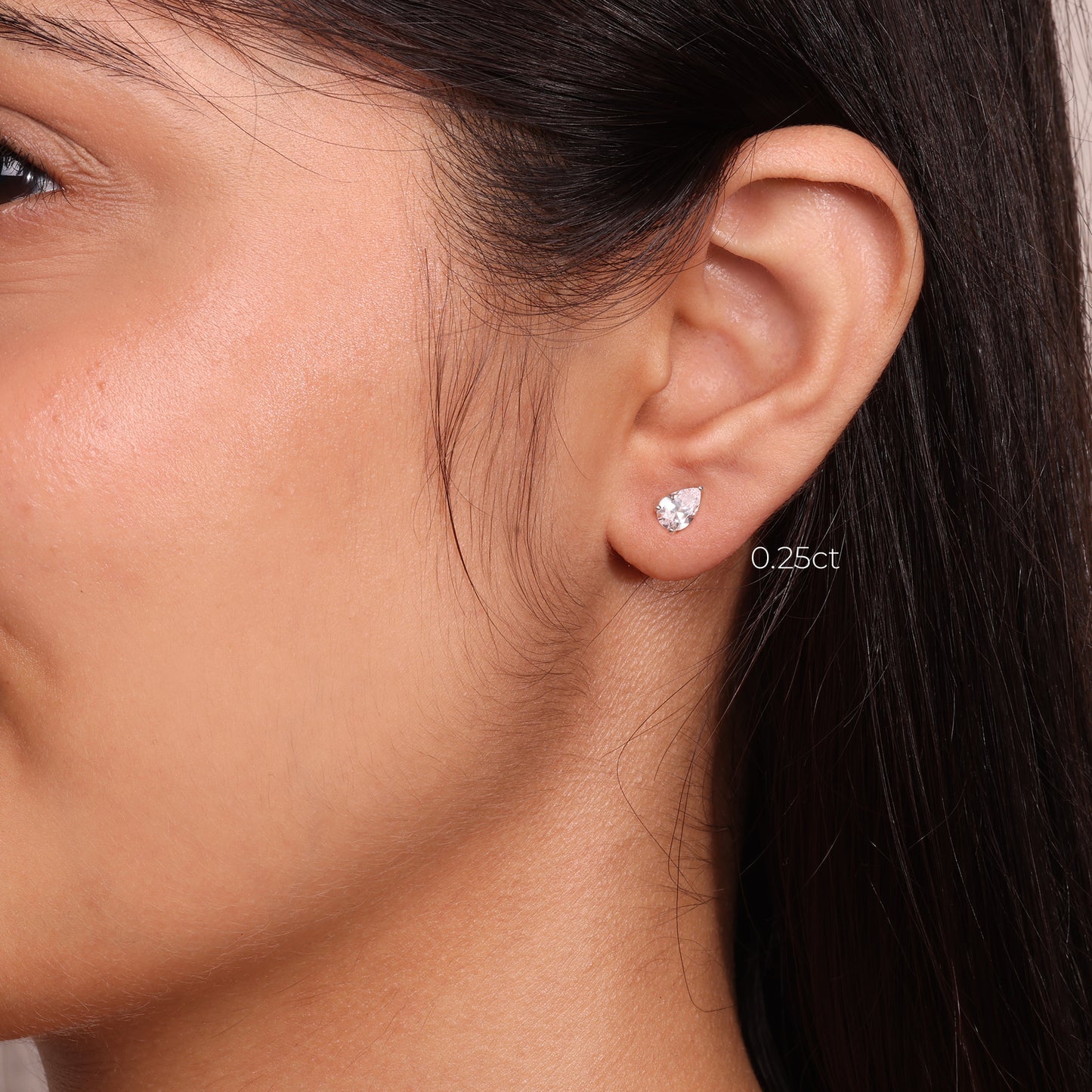 0.75 TCW Pear Cut Moissanite Stud Earrings in Gold 1