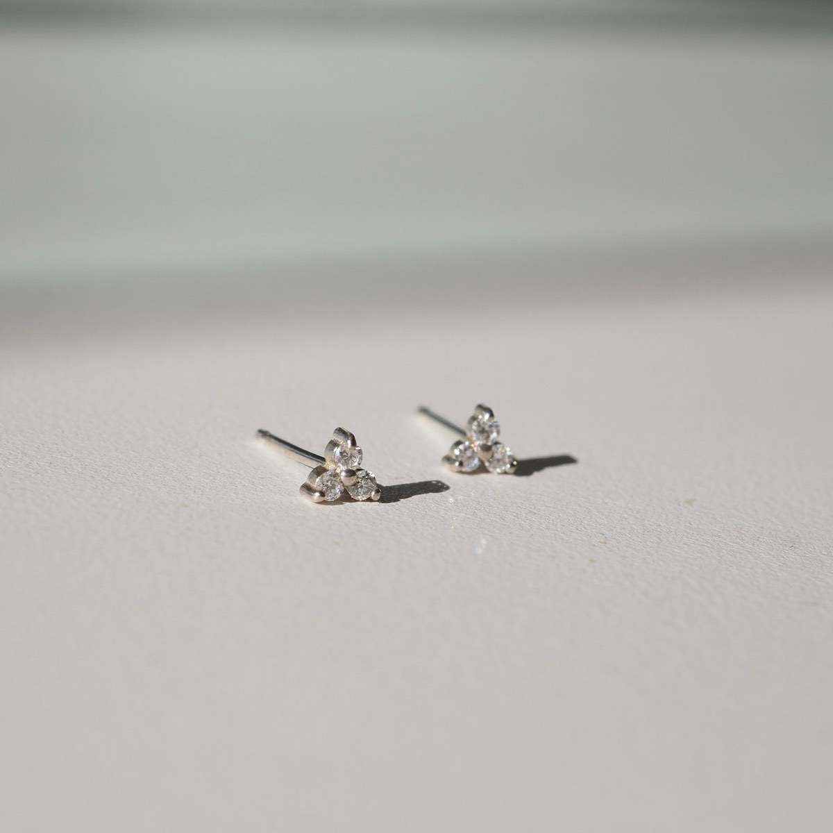 0.05 TCW Round Cut Moissanite Stud Earrings in Gold 1
