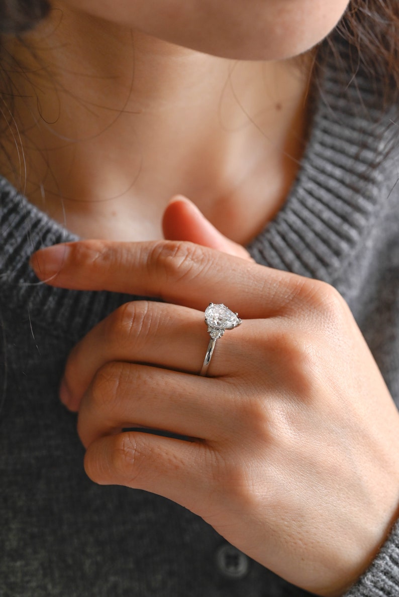 Stunning 1.0 - 2.0 CT Pear Moissanite Engagement Ring with Cluster Design 4