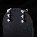0.83 TCW Round, Pear & Emerald Cut Moissanite Earrings in Gold 3