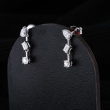 0.83 TCW Round, Pear & Emerald Cut Moissanite Earrings in Gold 3