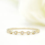 Stunning 0.2 TCW Round Moissanite Stones 5 Stones Wedding Bands 2