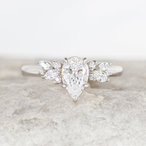 Stunning 1.25 CT Pear Moissanite Engagement Ring with Cluster Design