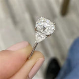 Stunning 1.0 CT Round Moissanite Engagement Ring with 3 Stones Design 4