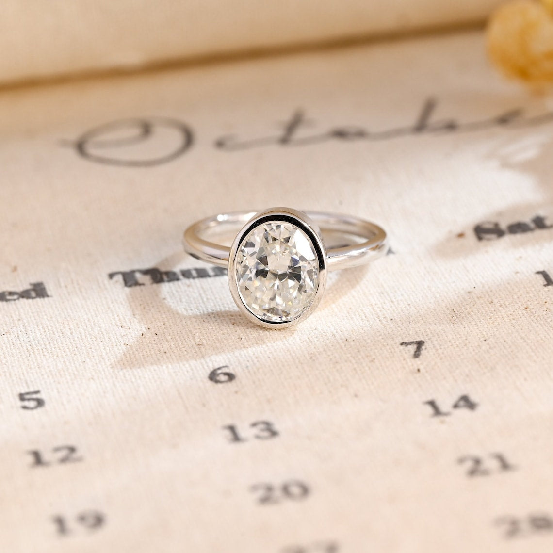 Stunning 1.0 CT Oval Cut Moissanite Engagement Ring with Solitaire Bezel Design 1