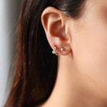 0.30 TCW Round Cut Moissanite Flower Huggies Earrings in Gold 5