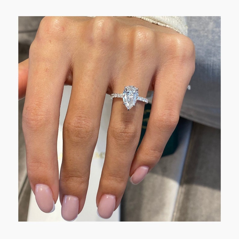 Stunning 2.0 CT Pear Moissanite Engagement Ring with Hidden Halo Halo & Pave Design 1