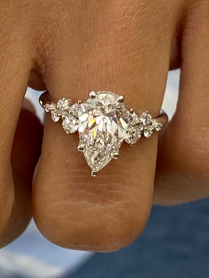 Stunning 1.50 CT Pear Moissanite Engagement Ring with Cluster Design 7