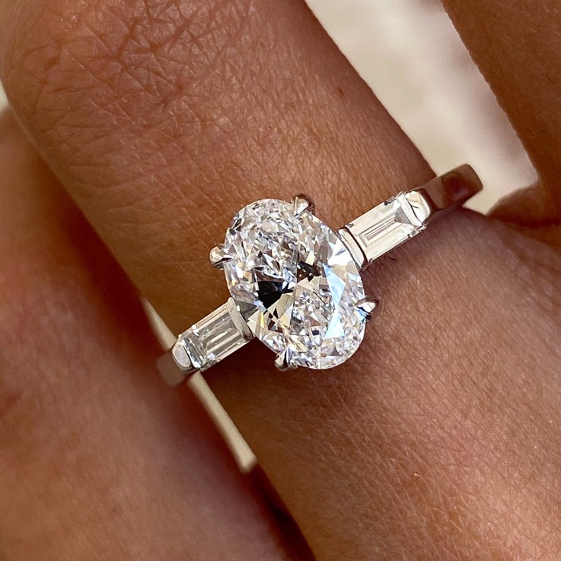 Stunning 1.0 CT Oval Moissanite Engagement Ring in Three stones Design 2