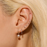 0.30 TCW Round Cut Moissanite Tiny Flower Stud Earrings in Gold 7