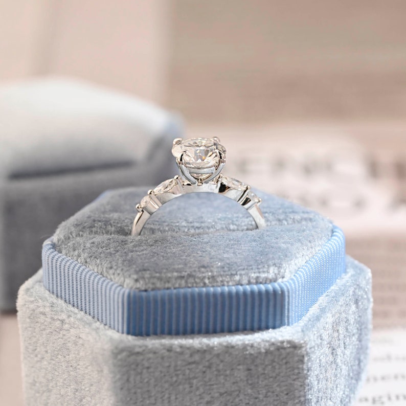 
                  
                    2.0 CT Round Shaped Moissanite Engagement Ring With Pave Accents
                  
                