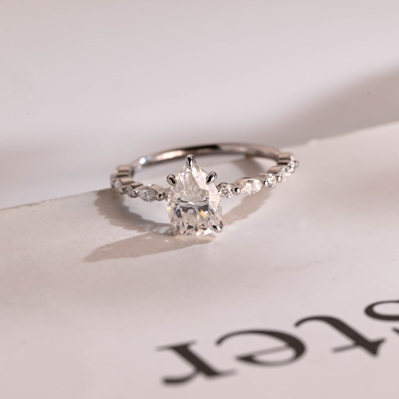 Stunning 1.0 - 2.0 CT Pear Moissanite Engagement Ring with Half Pave Design 3
