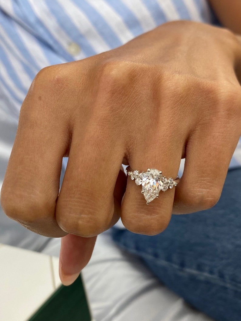 Stunning 1.50 CT Pear Moissanite Engagement Ring with Cluster Design 4