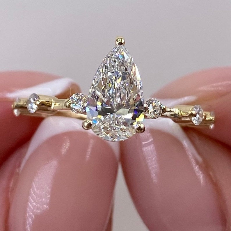 Stunning 1.0 CT Pear Moissanite Engagement Ring with Dainty Pave Design 1