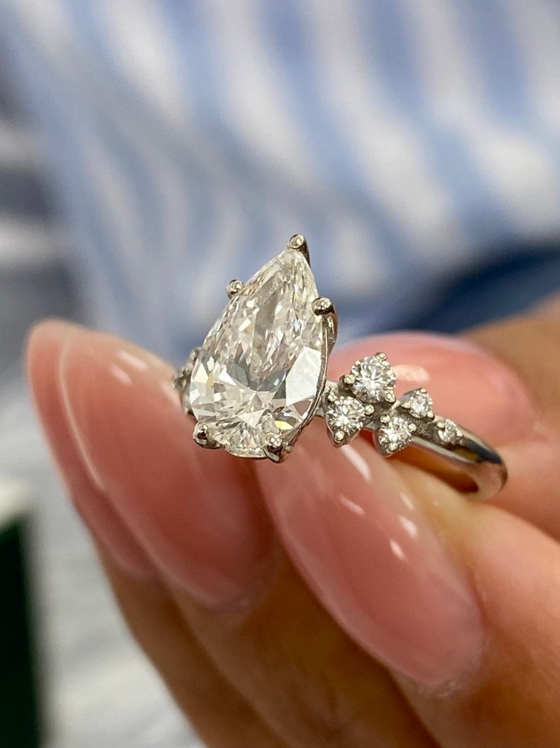 Stunning 1.50 CT Pear Moissanite Engagement Ring with Cluster Design 6