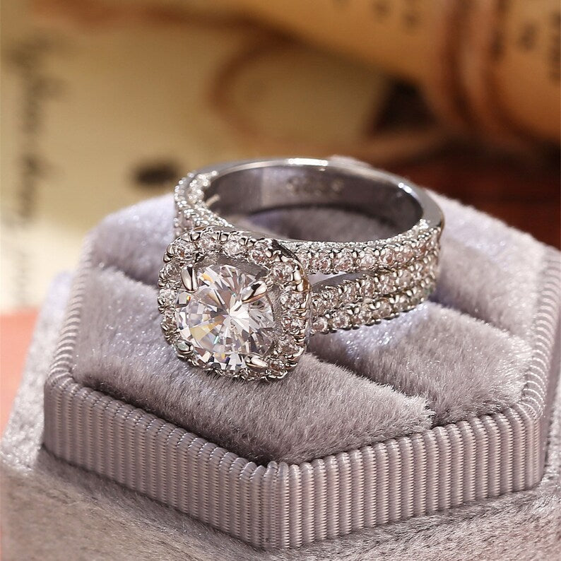 
                  
                    3.0 CT Round Shaped Moissanite Engagement Ring With Halo Split Shank Pave Style
                  
                