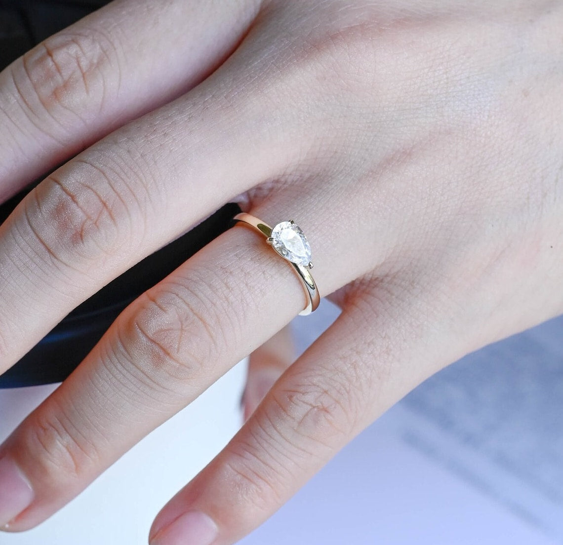 Stunning 0.8 CT Pear Moissanite Engagement Ring With East-West Solitaire Design 9