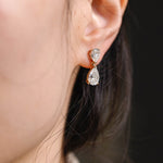 1.0 TCW Pear Cut Moissanite Drop Earrings in Gold 6