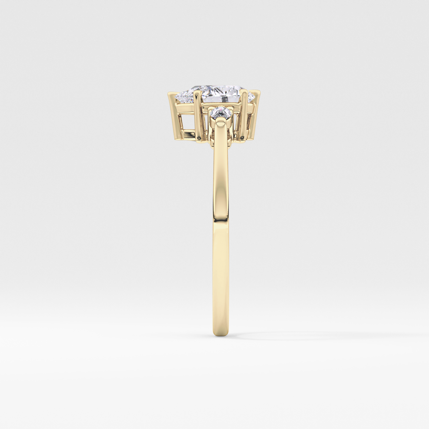 Pear Cut 0.86 Carat Moissanite Ring – Three Stones Setting in Gold