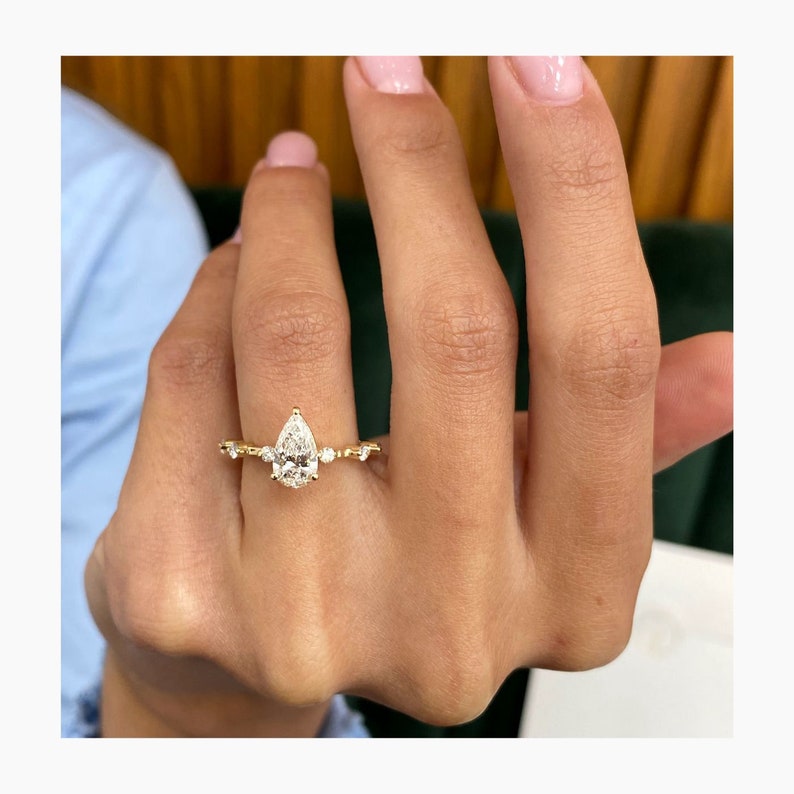 Stunning 1.0 CT Pear Moissanite Engagement Ring with Dainty Pave Design 6