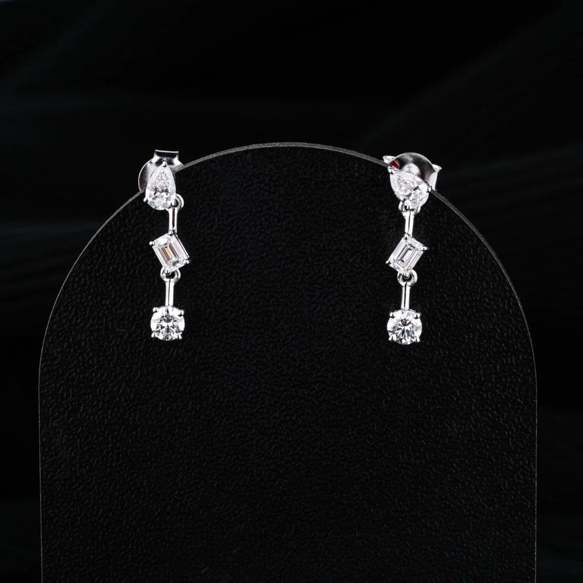 0.83 TCW Round, Pear & Emerald Cut Moissanite Earrings in Gold 1