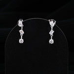 0.83 TCW Round, Pear & Emerald Cut Moissanite Earrings in Gold 1