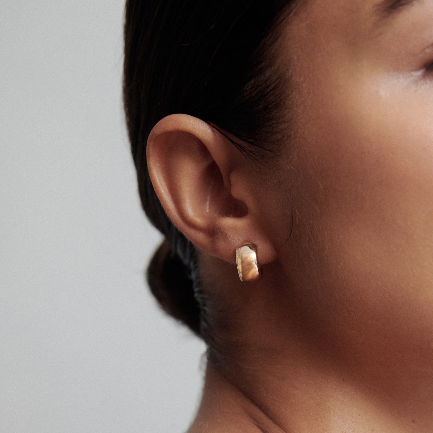 Wide Gold Huggies Earrings in Gold 4