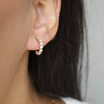 Stunning 0.50 TCW Round Cut Moissanite Huggies Earrings In Gold 4