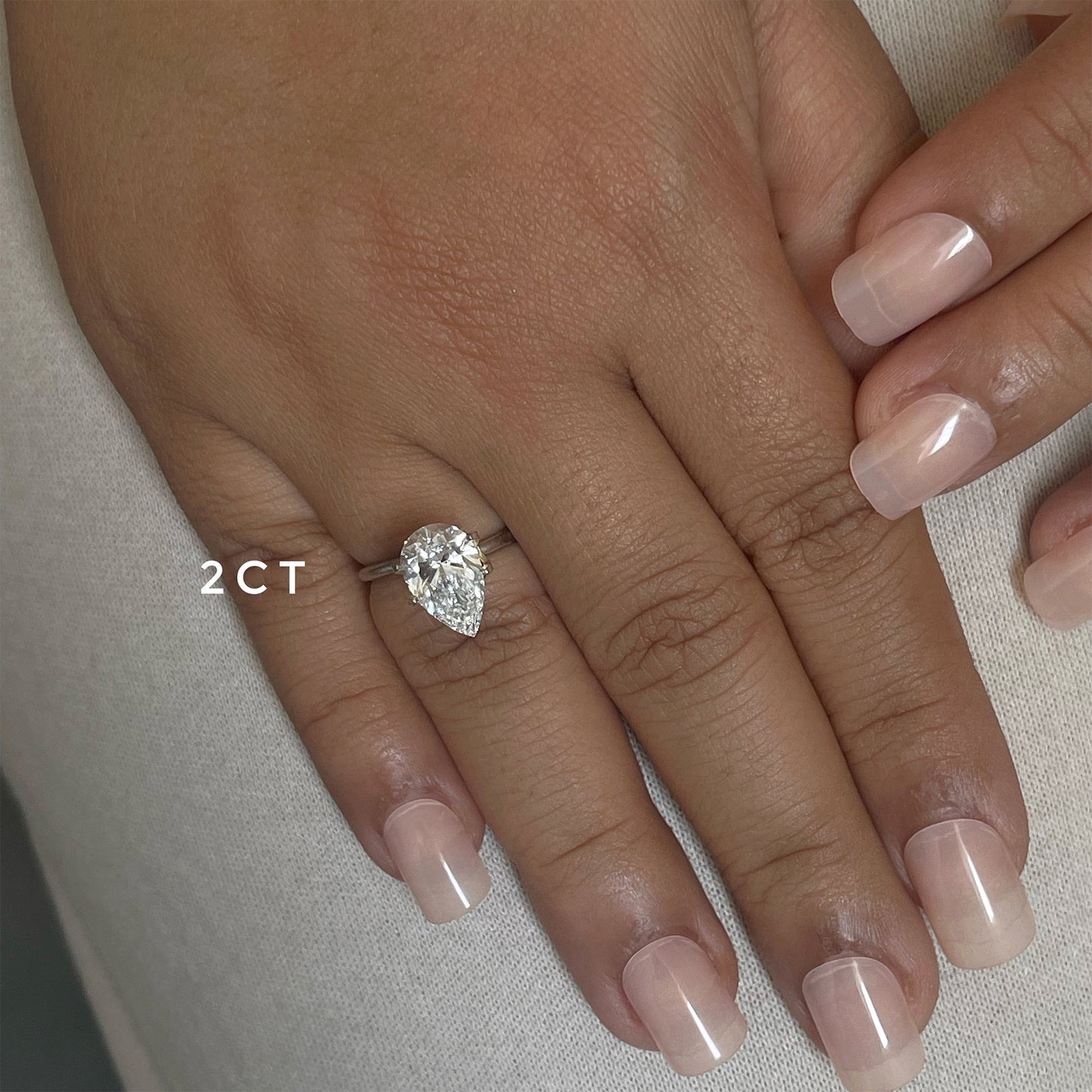 Stunning 1.0 CT Pear Moissanite Engagement Ring with Solitaire Design 4
