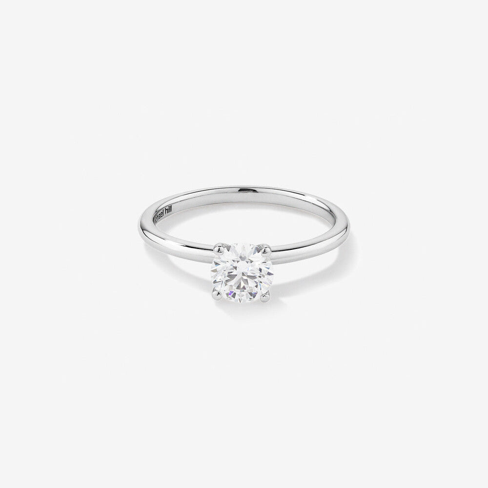Stunning 0.7 CT Round Moissanite Solitaire Design Engagement Ring 1