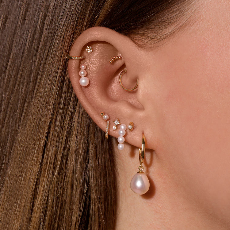 0.30 TCW Round Cut Moissanite Tiny Flower Stud Earrings in Gold 8