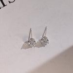 0.70 TCW Round Cut Moissanite Stud Earrings in Gold 9