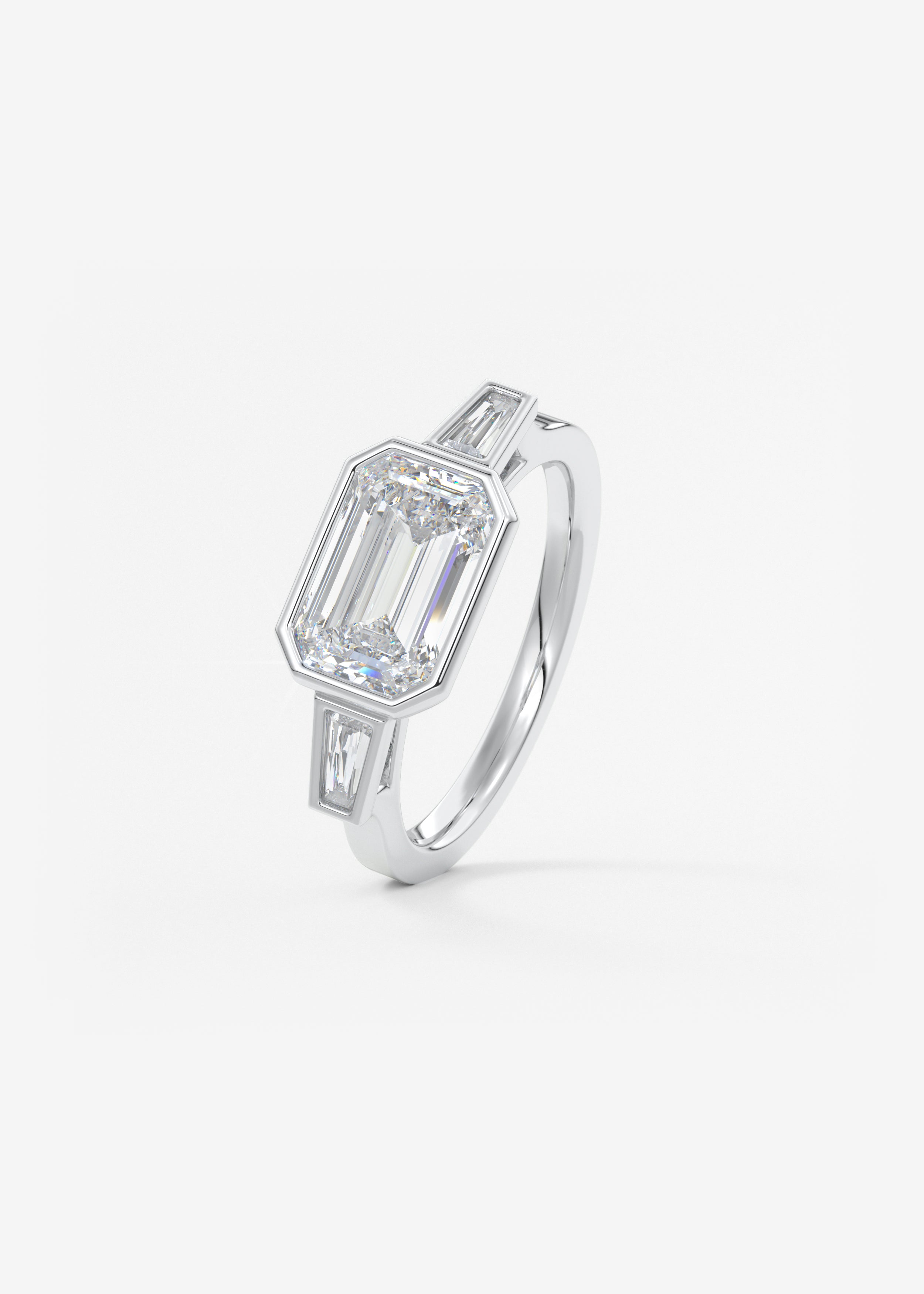 Emerald East West Three Stone Bezel Lab Grown Diamond Engagement Ring