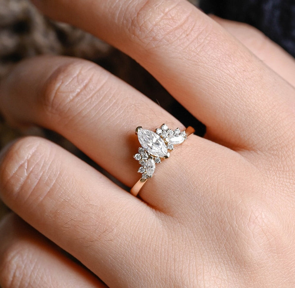 
                  
                    1.0 CT Marquise Shaped Moissanite Engagement Ring With Cluster Style
                  
                