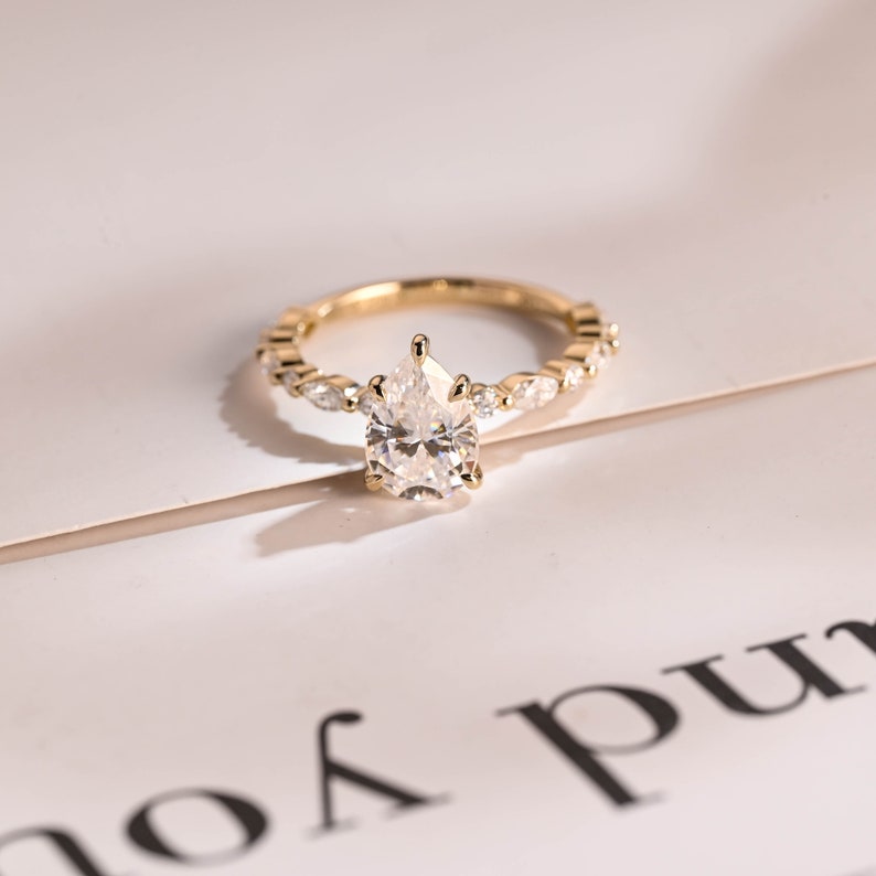 Stunning 1.0 - 2.0 CT Pear Moissanite Engagement Ring with Pave Design 10