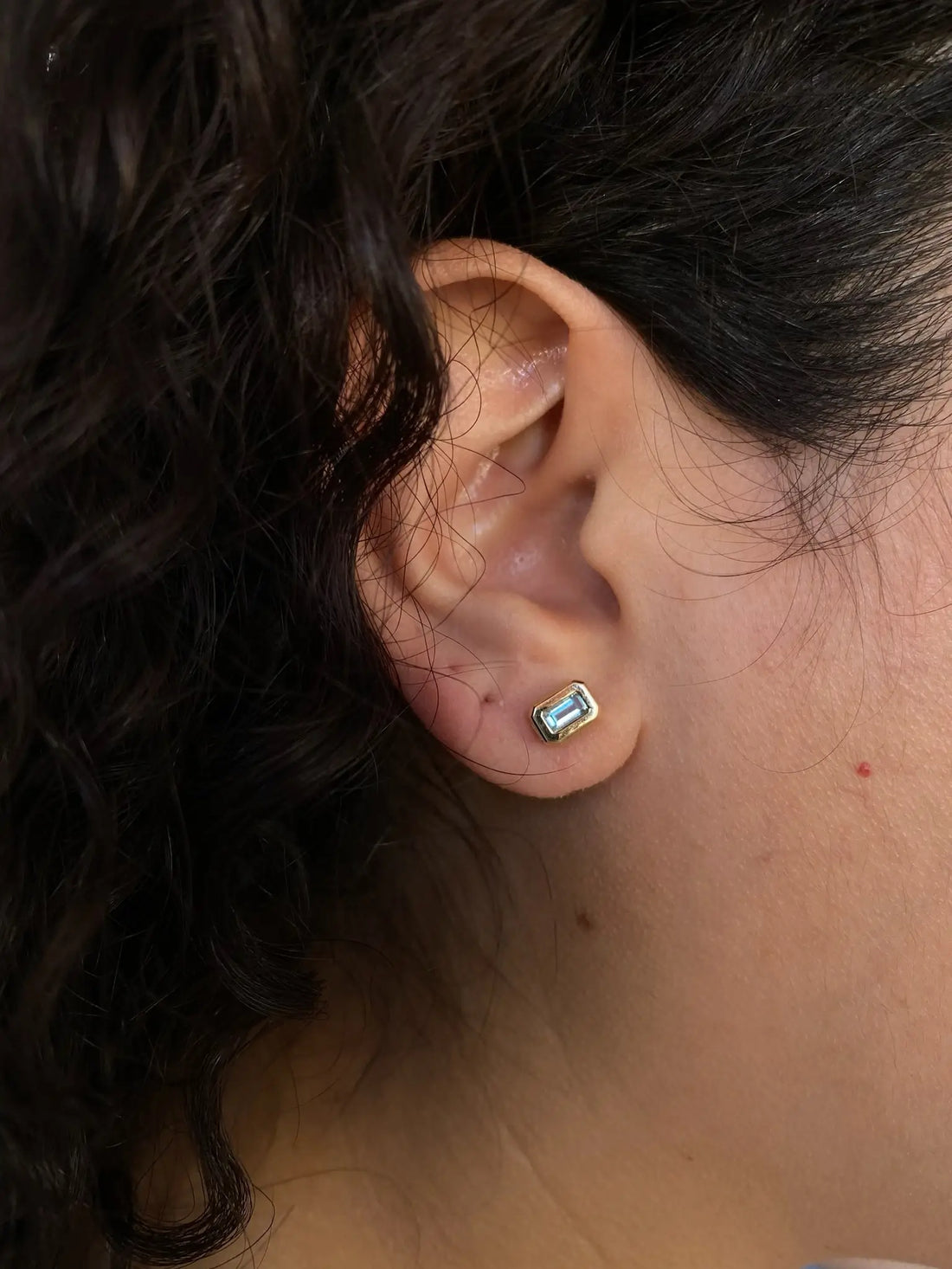 0.20 TCW Emerald Cut Moissanite Bezel Stud Earrings in Gold 3