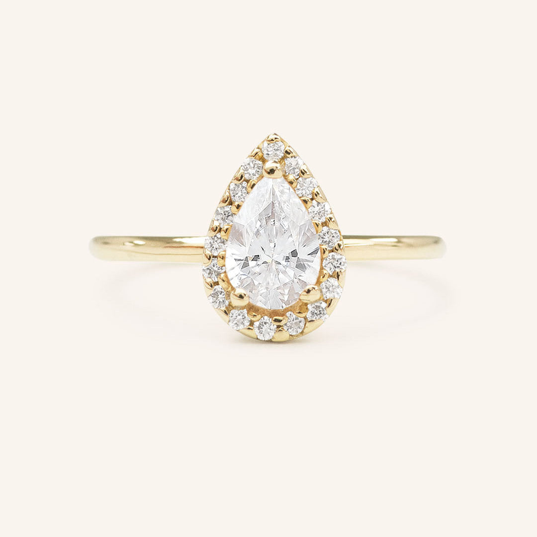 Stunning 0.74 CT Pear Moissanite Engagement Ring With Halo Design 1