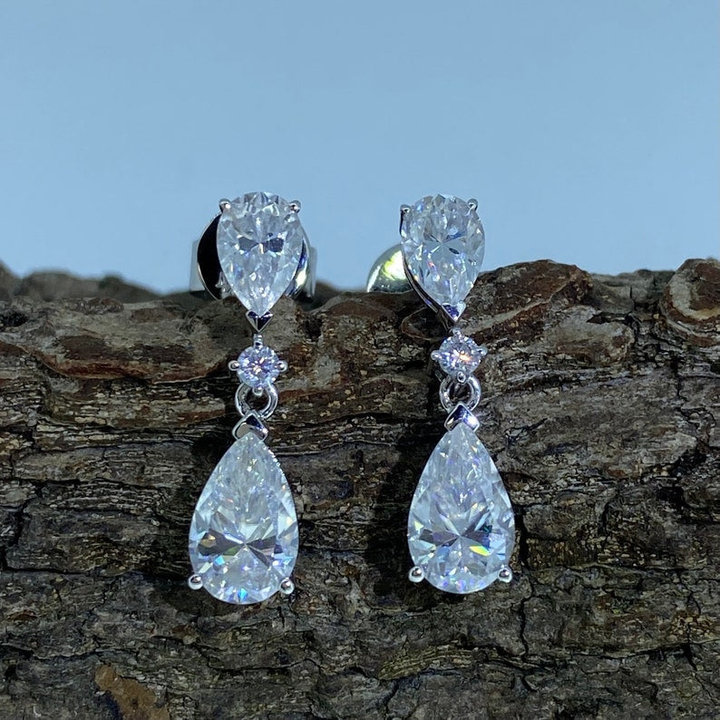 0.06 TCW Pear Cut Dangle Moissanite Earrings