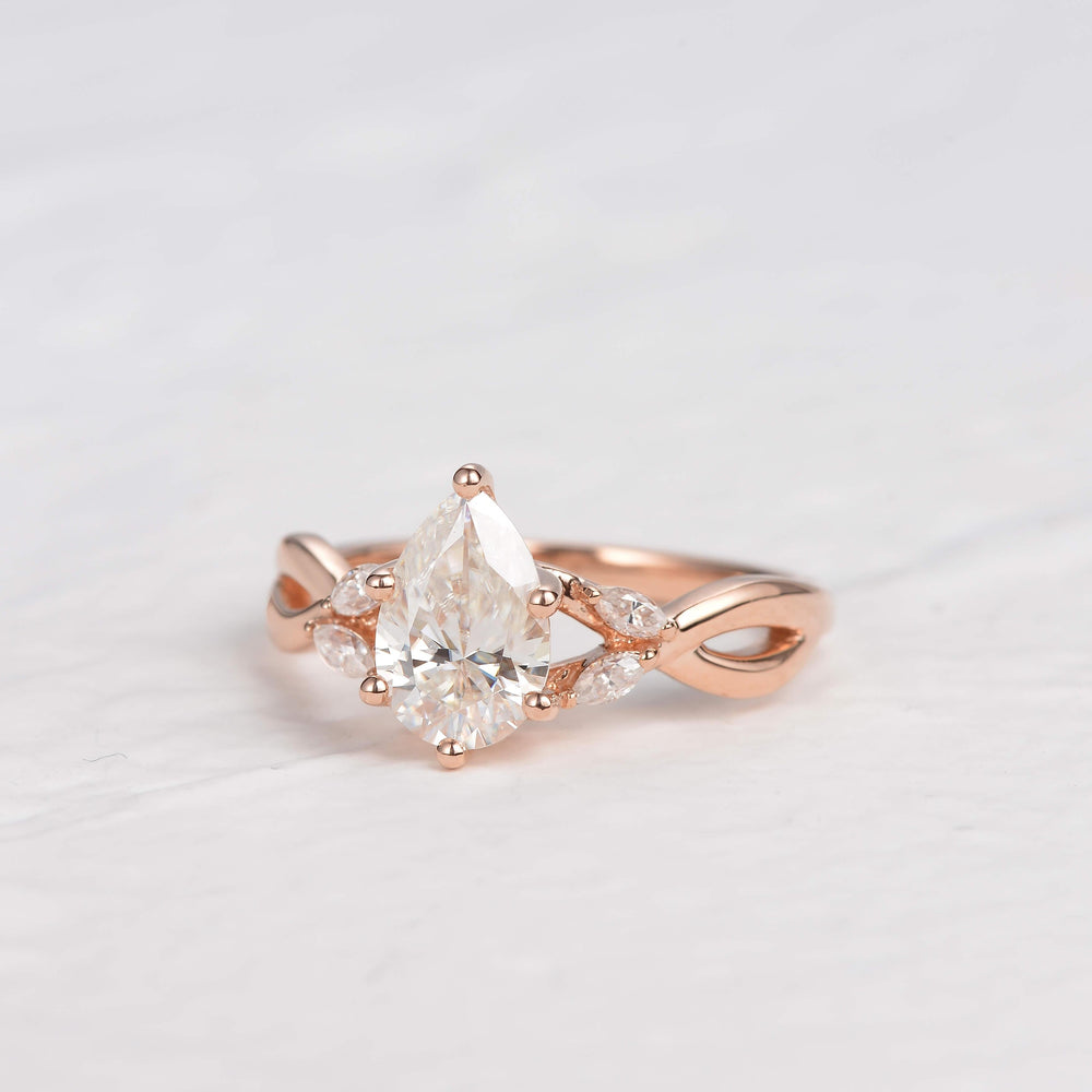 
                  
                    1.52 CT Pear Cut Twisted Moissanite Engagement Ring
                  
                