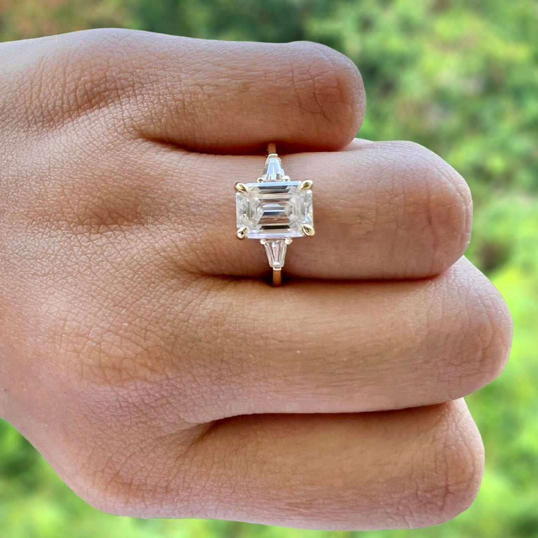 
                  
                    1.9 CT Emerald Cut Three Stone Moissanite Engagement Ring 3
                  
                