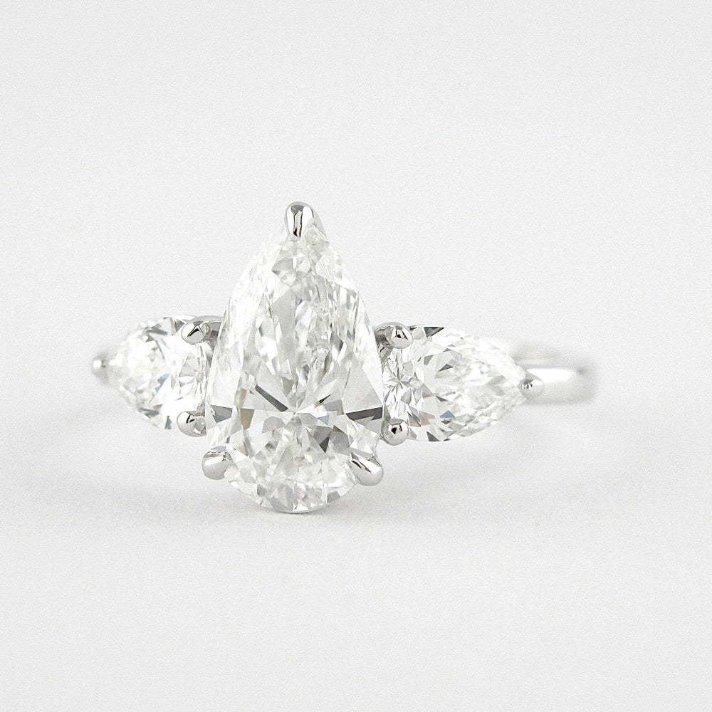 
                  
                    1.50 CT Pear Cut Three Stone Style Moissanite Engagement Ring
                  
                