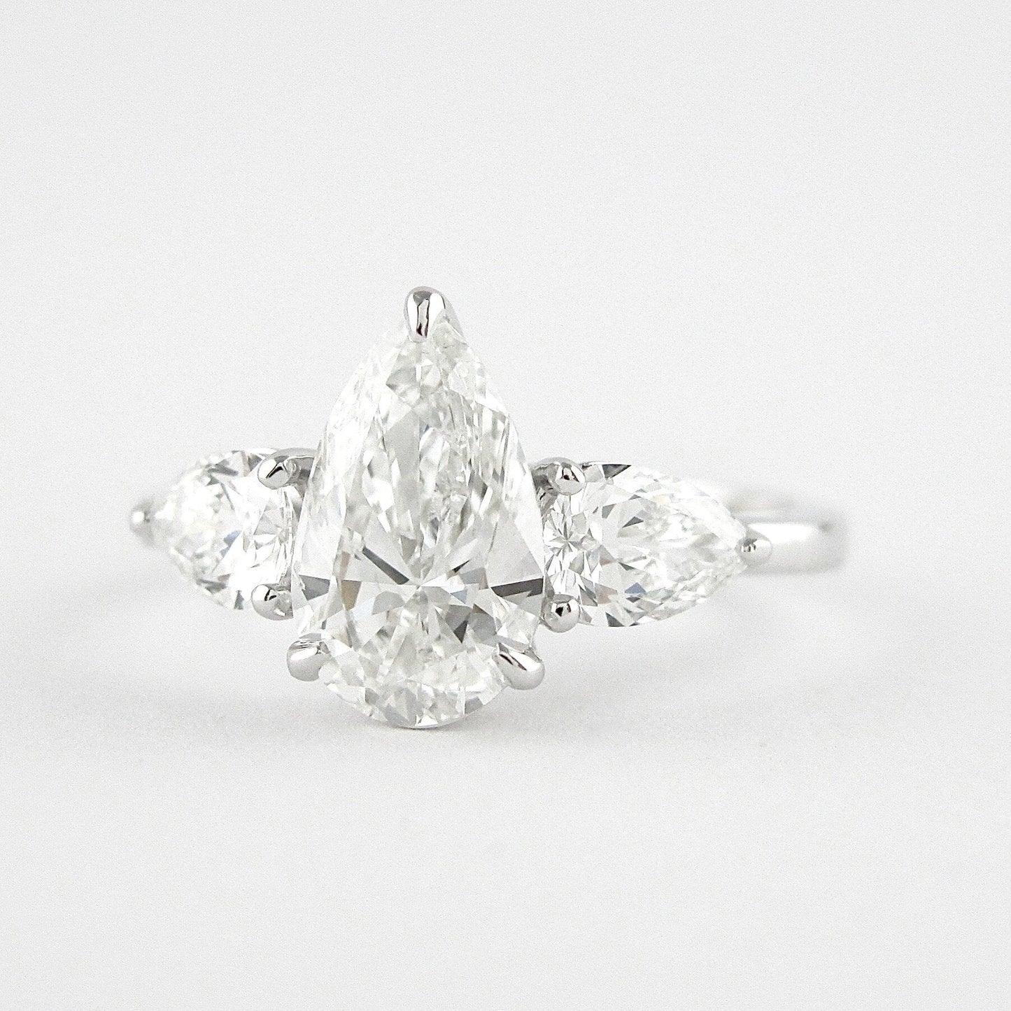 
                  
                    1.50 CT Pear Cut Three Stone Style Moissanite Engagement Ring 4
                  
                