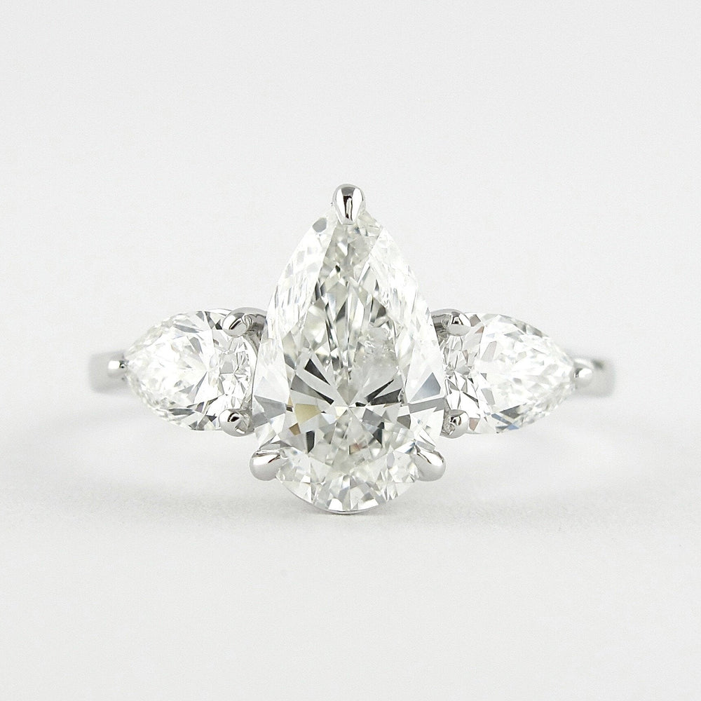 1.50 CT Pear Cut Three Stone Style Moissanite Engagement Ring 1