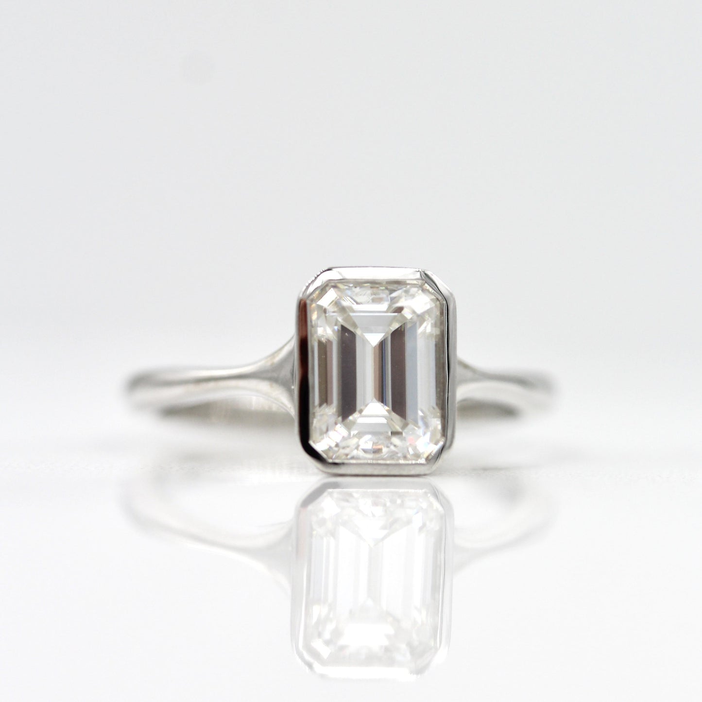 
                  
                    1.55 CT Emerald Cut Bezel Solitaire Moissanite Engagement Ring
                  
                