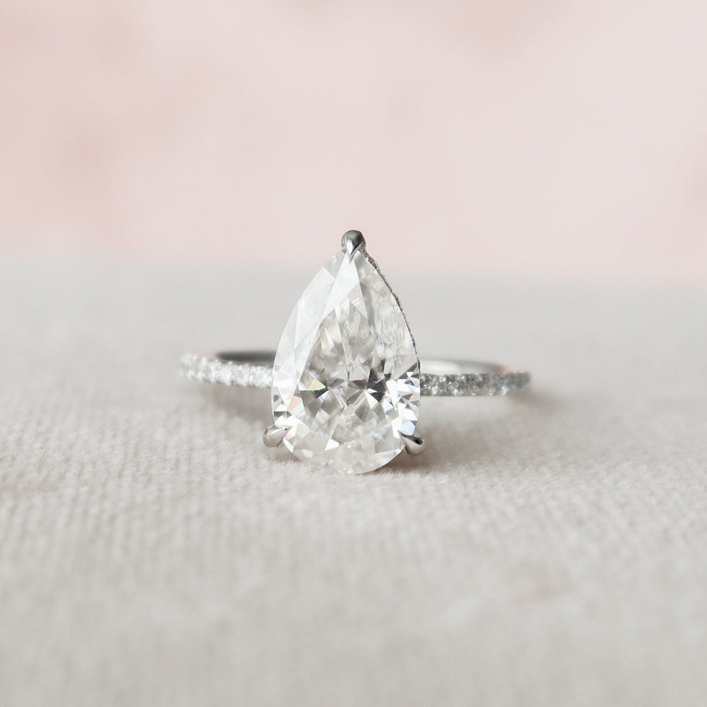 
                  
                    2.5 CT Pear Cut Hidden Halo & Pave Moissanite Engagement Ring
                  
                
