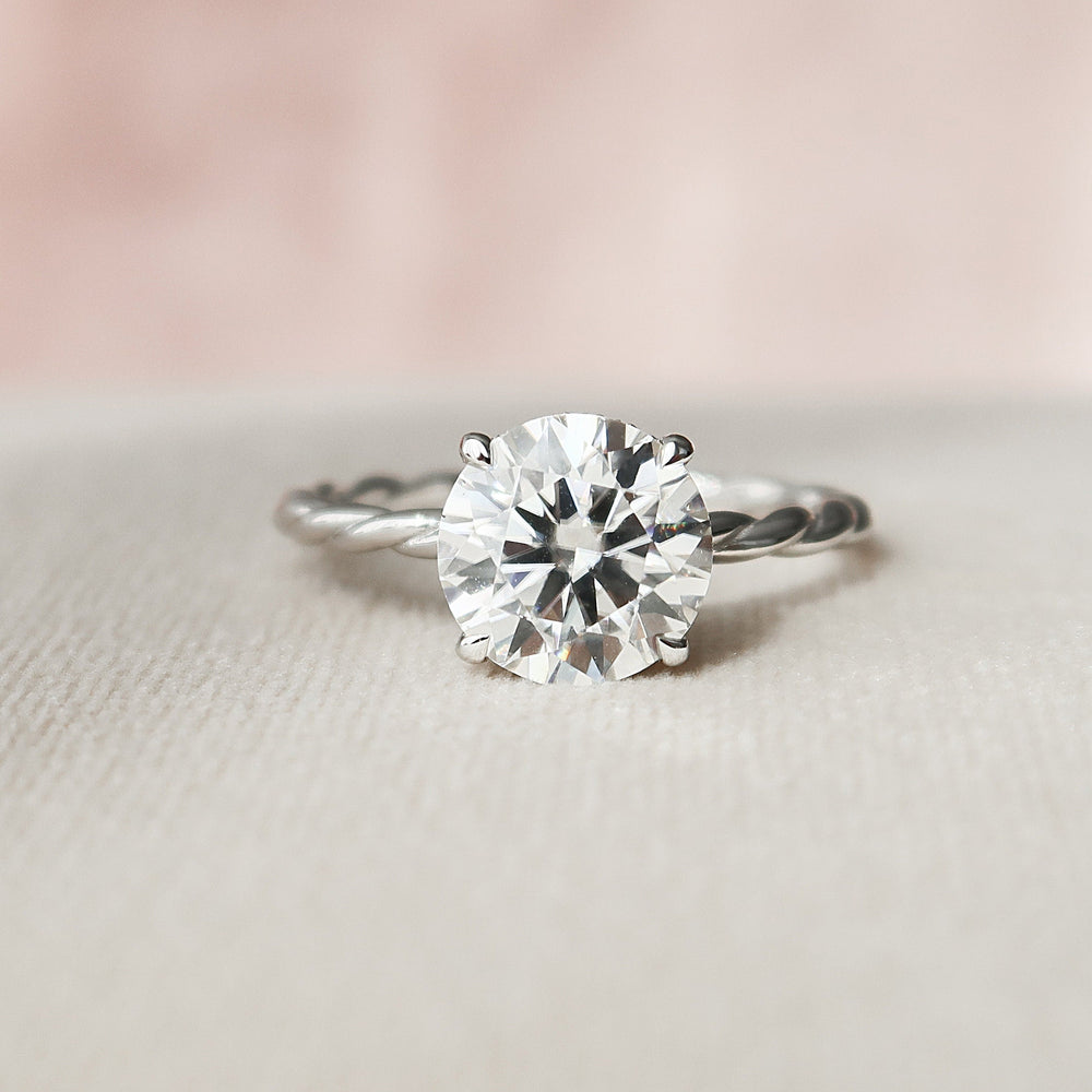 
                  
                    2.5 CT Round Cut Solitaire & Twisted Band Moissanite Engagement Ring
                  
                