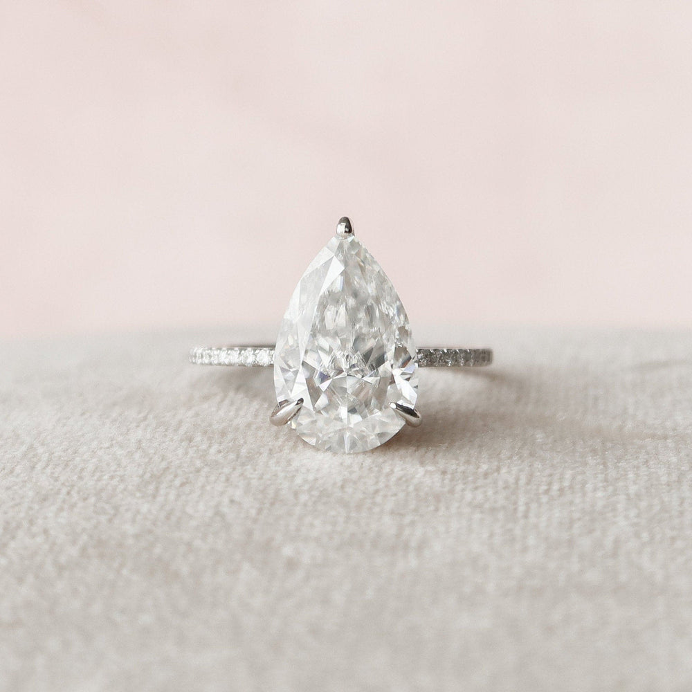 
                  
                    4.5 CT Pear Cut Solitaire & Pave Setting Moissanite Engagement Ring 4
                  
                