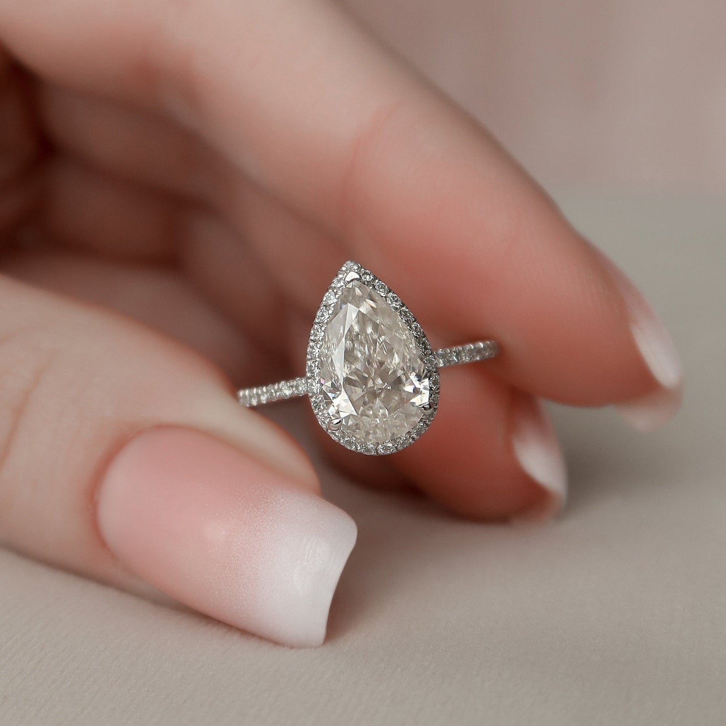 
                  
                    2.0 CT Pear Cut Halo & Pave Setting Moissanite Engagement Ring
                  
                